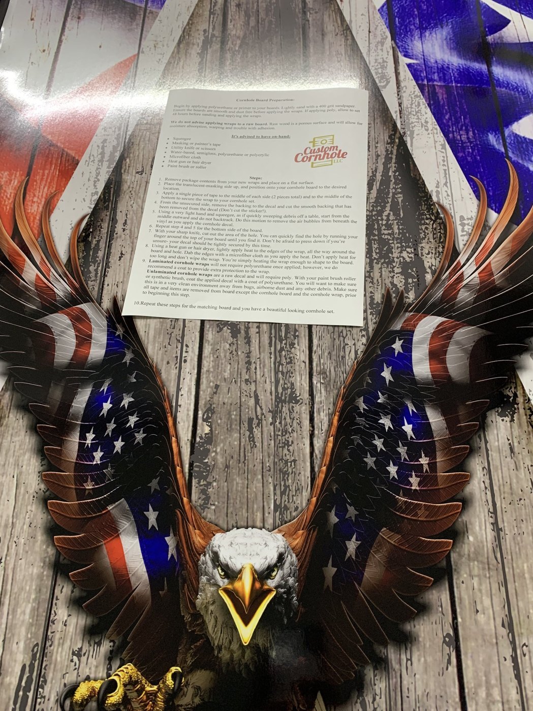 Printed cornhole wraps packaged with installation instructions